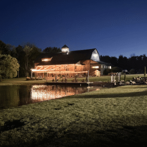 The Reception Barn and Dock by the Pond at Night